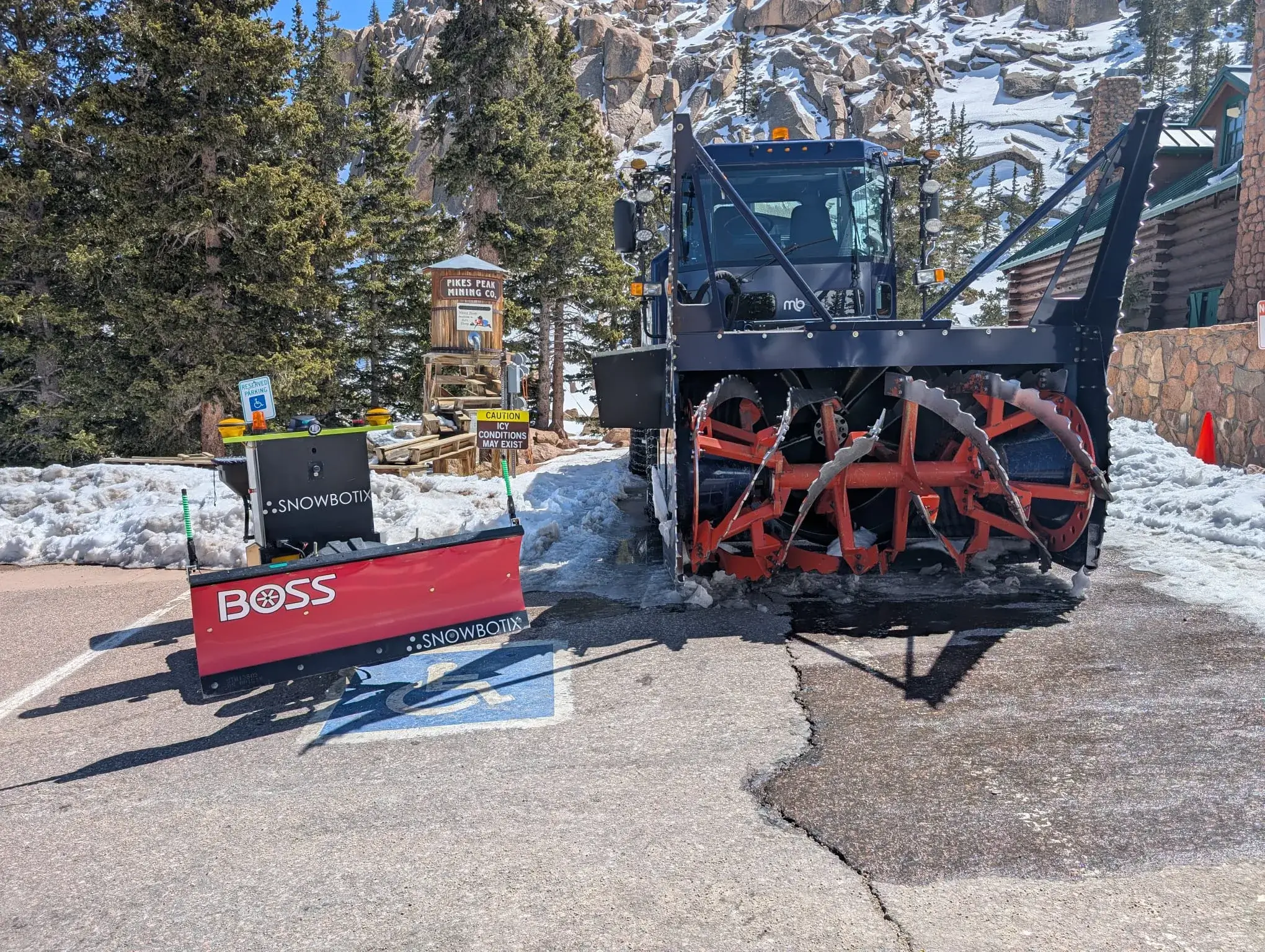A Snowbotix SMUR unit fitted with a rotary snow blower during the Pikes Peak region municipal pilot at altitude.