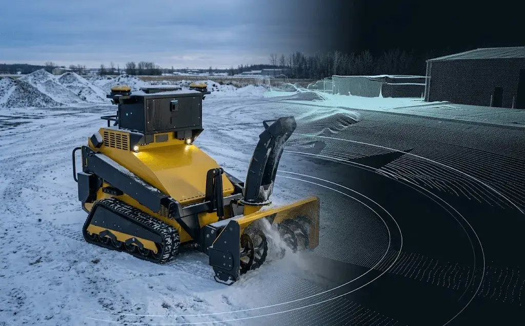 A SMUR X1 snow robot clearing snow with its mapped coverage path drawn as a wireframe overlay on the ground.
